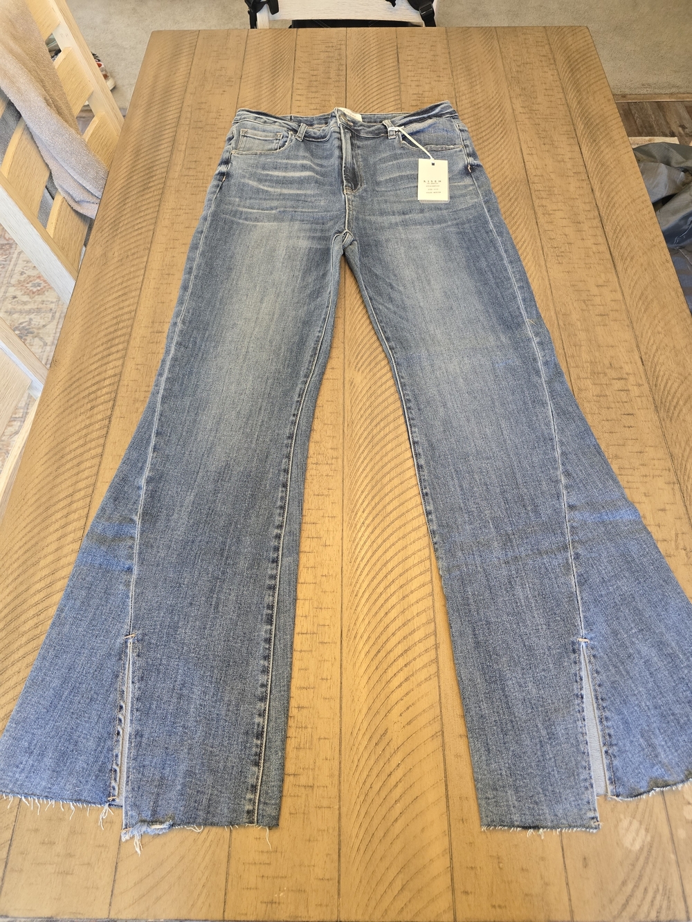 Risen High Rise Twisted Hem Flared Jeans